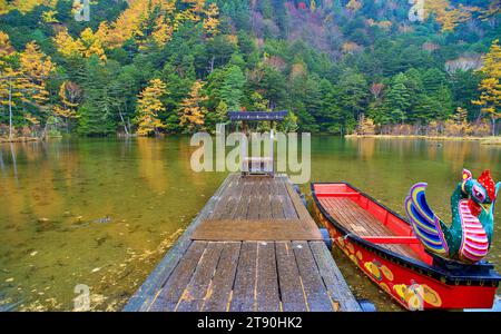 Idyllic landscape of Myojin pond at Hotaka Rear shrine in Kamikochi, Nagano, Japan (Japanese language meaning 'Myojin Pond') Stock Photo