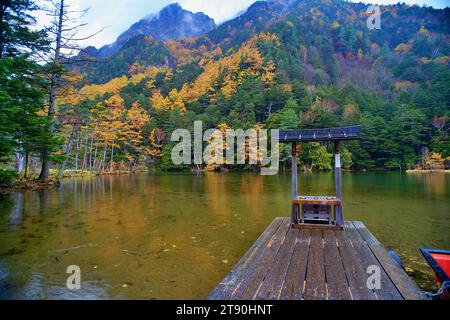 Idyllic landscape of Myojin pond at Hotaka Rear shrine in Kamikochi, Nagano, Japan (Japanese language meaning 'Myojin Pond') Stock Photo