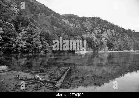 Idyllic landscape of Myojin pond at Hotaka Rear shrine in Kamikochi, Nagano, Japan (Japanese language meaning 'Myojin Pond') Stock Photo