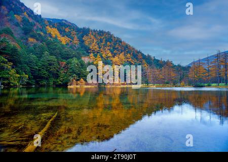 Idyllic landscape of Myojin pond at Hotaka Rear shrine in Kamikochi, Nagano, Japan (Japanese language meaning 'Myojin Pond') Stock Photo