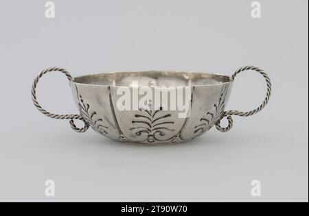 Two-handled bowl, c. 1690, Jacob Boelen, American, 1654-1729, 1 1/2 x 4 1/8 in. (3.8 x 10.48 cm), Silver, United States, 17th-18th century, Boelen, an American silversmith of Dutch descent working in New York, belonged to a family of silversmiths. Dummer was a prominent Boston businessman and church leader in addition to working as a silversmith. Boelen's bowl recalls contemporaneous Dutch bowls with its division into six lobes and heavily chased decoration. The chasing displaces the metal, allowing the design to be visible on both exterior and interior. Its handles consist of drawing wire Stock Photo