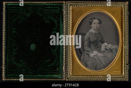 three-quarter view of a woman seated in the 'Gurney chair', 1852-1858, Jeremiah Gurney, American, 1812 - 1895, 4 1/4 x 3 1/4 in. (10.8 x 8.26 cm) (image)4 11/16 x 3 11/16 x 11/16 in. (11.91 x 9.37 x 1.75 cm) (mount), Daguerreotype (1/4 plate), hand tinted, United States, 19th century Stock Photo
