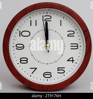 analog table clock isolated on white background. clock change at midnight. seconds before the new year. seconds before the new day. Stock Photo