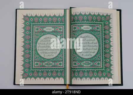 The first page of the original Koran made in Medina. Surah Fatiha. isolated on white background. top view. Stock Photo