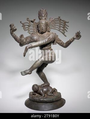 Shiva Nataraja (Lord of the Dance), c. 1100, 28 in. (71.12 cm), Bronze, India, 11th or 12th century, The Hindu god Shiva appears in several incarnations. Here, Shiva appears as Nataraja, or Lord of the Dance. He raises his left foot in a graceful dance pose. In his upper right hand, Nataraja holds a drum, the sound of which manifests creation. The flame that he holds in his upper left hand symbolizes destruction. Together, they symbolize the creation and destruction of the cosmic universe. The posture of the icon’s lower left and right palms signifies protection. Stock Photo