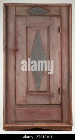 Armoire, one of a pair, c. 1800, 68 x 26 1/2 x 26 1/2 in. (172.7 x 67.3 x 67.3 cm), Pine, pigment, iron, United States, 18th-19th century, The original red and blue painted surface on this corner armoire makes it a rare survival of French Canadian inspired furniture from the mid-Mississippi River valley during the early years of American settlement. Also called a bonnetiére, this single-door armoire has a history of ownership in Calhoun County, Illinois, just north of the 18th-century French and French Canadian settlements of St. Louis, Missouri, and Cahokia, Illinois. Stock Photo