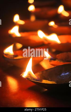 traditional oil lamps lit at the night during diwali or deepavali celebration, this hindu-indian festival also known as festival of lights Stock Photo