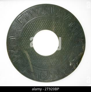 Bi (Ceremonial Disk Symbolizing Heaven), 206 BCE - 220 CE, 12 1/2 x 1/4 in. (31.75 x 0.64 cm) (outer diameter), Mottled green jade, China, 3rd century BCE - 3rd century CE Stock Photo