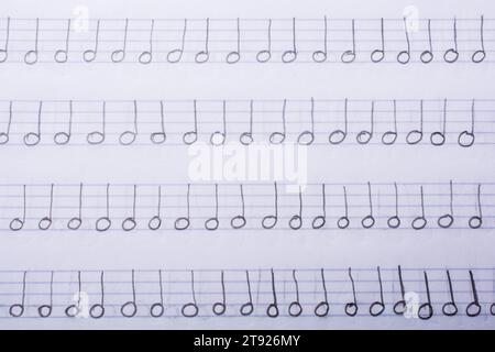 Hand written musical notes are found on paper Stock Photo