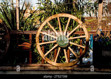 Old traditional style wagon wheel made of wood Stock Photo