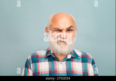 Funny portrait of old bald man bearded man with grey moustache beard. Stock Photo