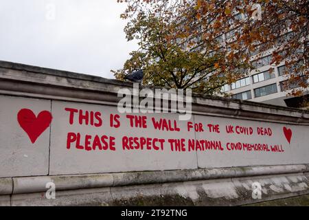 London, UK. 22nd November, 2023. The Covid-19 Enquiry is currently taking place in London with Patrick Vallance and Professor Sir Chris Whitty giving evidence about the chaos that ensured whilst former Primer Minister Boris Johnson oversaw the Covid-19 Pandemic and lockdown. Pictured the National Covid Memorial Wall next to the River Thames in London by St Thomas' Hospital. The red hearts are repainted on a regular basis so as to not forget all those who have died of Covid-19 since the Pandemic started. Credit: Maureen McLean/Alamy Live News Stock Photo