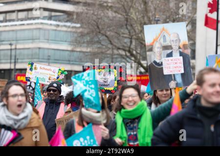 Placards are held during a march and rally called by the NEU (National Education Union) in London. Stock Photo
