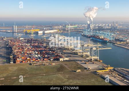 Rotterdam, The Netherlands - December 14, 2022: Aerial view Industrial area Maasvlakte Port of Rotterdam with cranes and storage area sea containers Stock Photo