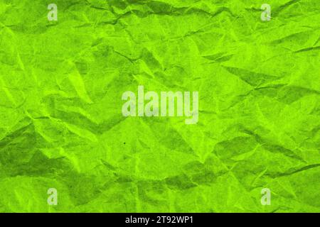 Green crumpled paper background. Copy space Stock Photo