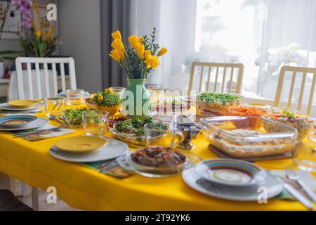 Easter. Traditional Polish Easter breakfast on a festive table with bright stylish decor and classic dishes on a yellow tablecloth Stock Photo