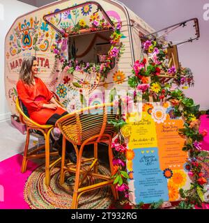 London, UK. 22nd Nov, 2023. London UK 22 November 2023 A colourful cake and tea caravan for those who wish to take a little break at the show . Credit: Paul Quezada-Neiman/Alamy Live News Stock Photo