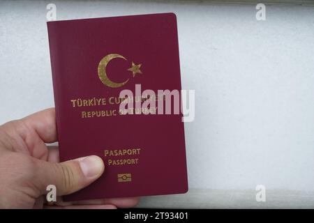 Republic of Türkiye passport, hand holding the passport Stock Photo