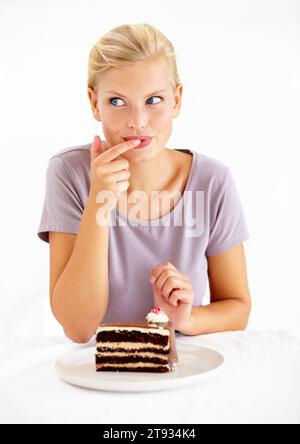 Plus size girl greedy eats sweet pie. Hungry fat model lie on table and  eating dessert. Weight loss concept. red curly hair overweight women with  delicious cake Stock Photo | Adobe Stock