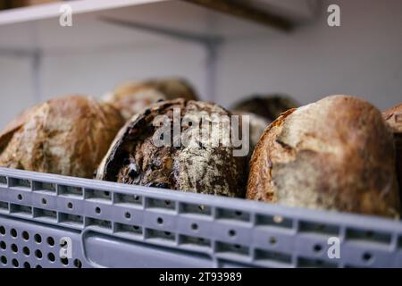 Close-up of loaves of bread in a basket ready for distribution Stock Photo