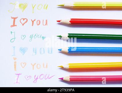 Paper with love you message and colored pencils Stock Photo