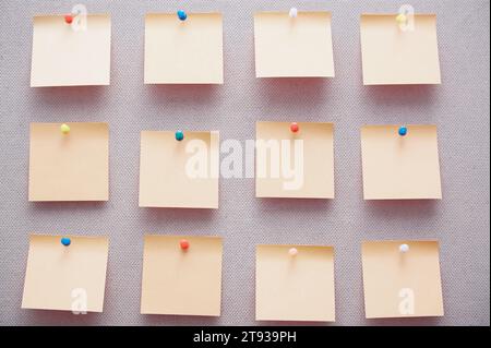 Sticky notes on a bulletin board. Close-up view Stock Photo