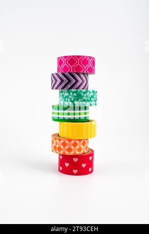 Photo showing a stack of washi tape in rainbow colors and a variety of patterns Stock Photo