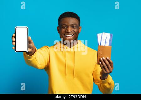 Tourism and holiday trip concept, black guy showing phone Stock Photo