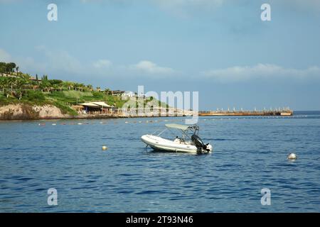 Inflatable boat on sea under blue sky Stock Photo