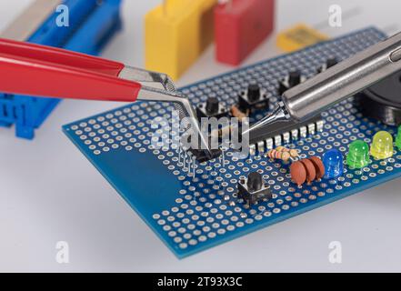 Detail of electronic soldering on a circuit board in laboratory Stock Photo