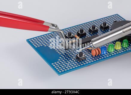 Detail of electronic soldering on a circuit board in laboratory Stock Photo