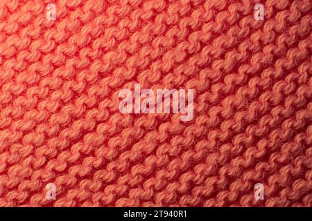 Texture of the fabric of a red sweater. Stock Photo
