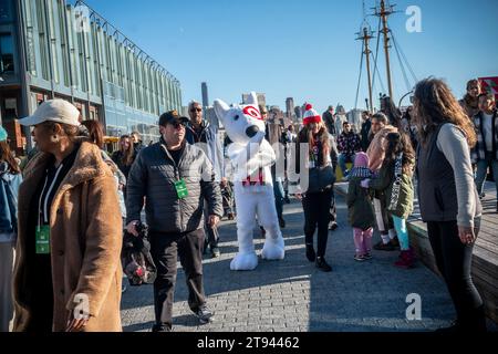 An actor dressed as the Target mascot dog, Bullseye, at the Target 'Wonderland' pop-up at the South Street Seaport in New York on Sunday, November 19, 2023. The experiential brand activation attracted so many people that the wait to enter stretched to two hours. (© Richard B. Levine) Stock Photo