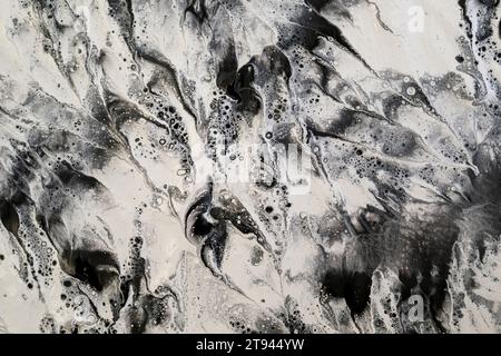 Background created with black and white acrylic paint forming a marbleized texture perfect for backgrounds and graphic resources Stock Photo