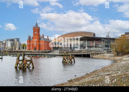The historic Pierhead Building and the National Assembly for Wales building, Cardiff Bay, Cardiff, UK Stock Photo