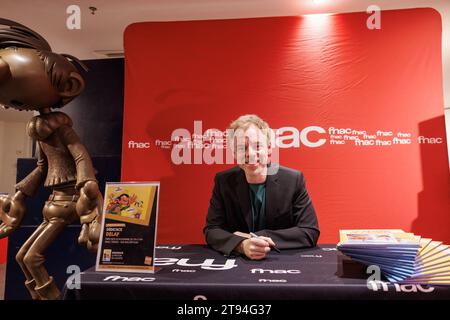 Paris, France. 22nd Nov, 2023. Canadian comic strip artist Marc Delafontaine, aka Delaf, signs a few copies of the new comic strip entitled 'Le Retour de Lagaffe' (The Return Of Gaston Lagaffe) at FNAC Ternes in Paris on 22 November 2023. Gaston Lagaffe, the comic strip hero who hasn't appeared in print since 1999, will be back in bookshops on 22 November 2023 with a new artist, the Canadian Delaf, whose loyalty to Franquin has been hailed by the critics. Photo by David Boyer/ABACAPRESS.COM Credit: Abaca Press/Alamy Live News Stock Photo