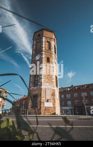 Oldest Tour du Leughenaer building in Dunkirk with the original clock in the centre of the tower. French history. Stock Photo