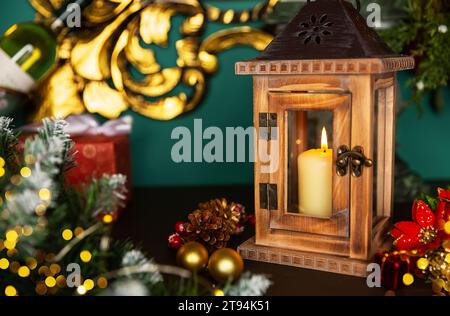 Holiday greeting card design with Christmas scene. Lantern with candle and Christmas decorations on a old wooden table Stock Photo