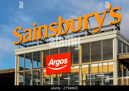 A sign for Sainsbury's and Argos on a large Sainsbury's supermarket in King's Lynn, Norfolk Stock Photo