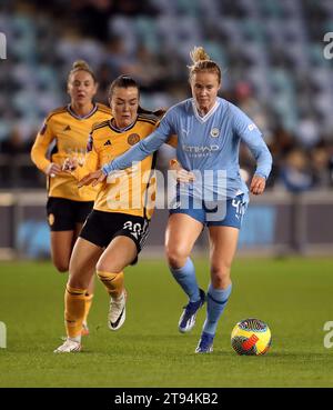 Leicester City's Missy Goodwin and Manchester City's Julie Blakstad (right) battle for the ball during the FA Women's Continental Tyres League Cup Group B match at the Manchester City Joie Stadium, Manchester. Picture date: Wednesday November 22, 2023. Stock Photo