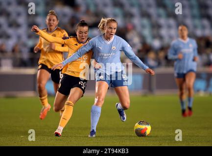 Leicester City's Missy Goodwin and Manchester City's Julie Blakstad (right) battle for the ball during the FA Women's Continental Tyres League Cup Group B match at the Manchester City Joie Stadium, Manchester. Picture date: Wednesday November 22, 2023. Stock Photo