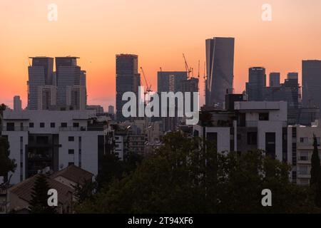 Tel Aviv, Israel - October 6, 2023 - Aerial view of Tel Aviv in the sunset. Skysrapers and streets seen from the financial district of the city. Stock Photo