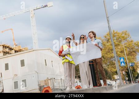 Corporate Team Collaborating on Sustainable Design for New Urban Project Stock Photo
