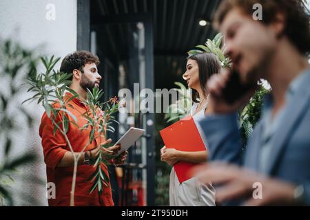 Collaborative Architects Discussing Blueprint at Construction Site Stock Photo