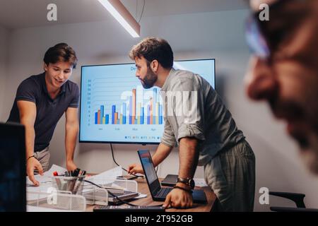 Business Professionals Collaborating on Innovative Project Strategy in a Modern Boardroom Stock Photo