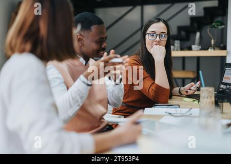 Multiracial Business Group Collaborating on Strategic Planning and Market Analysis in Corporate Office Stock Photo