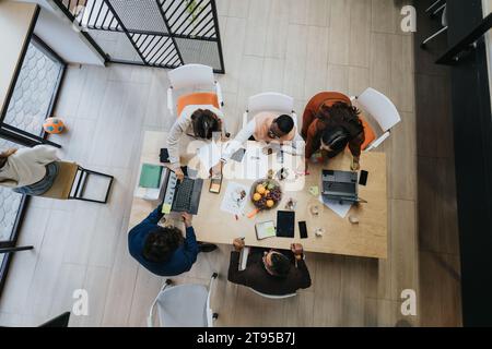 Afternoon Meeting. Top View Image of Accountants Discussing Financial Planning and Creative Solutions for Business Growth Stock Photo