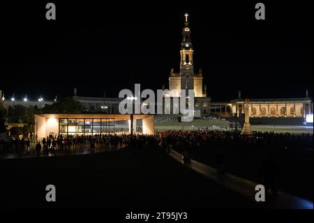 The evening candlelight prayer of the rosary around the Chapel of the Apparitions. Sanctuary of Our Lady of the Rosary of Fátima in Fátima, Portugal. Stock Photo