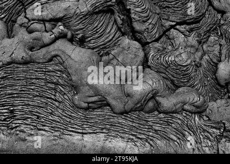 Background: nature's art graphic resource. A monochrome scene of a black volcanic lava formation with white sand highlights on Santiago island one of Stock Photo