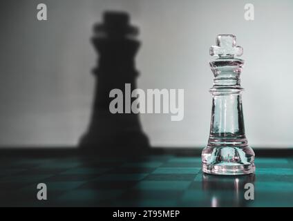 chess king and his shadow on the board Stock Photo